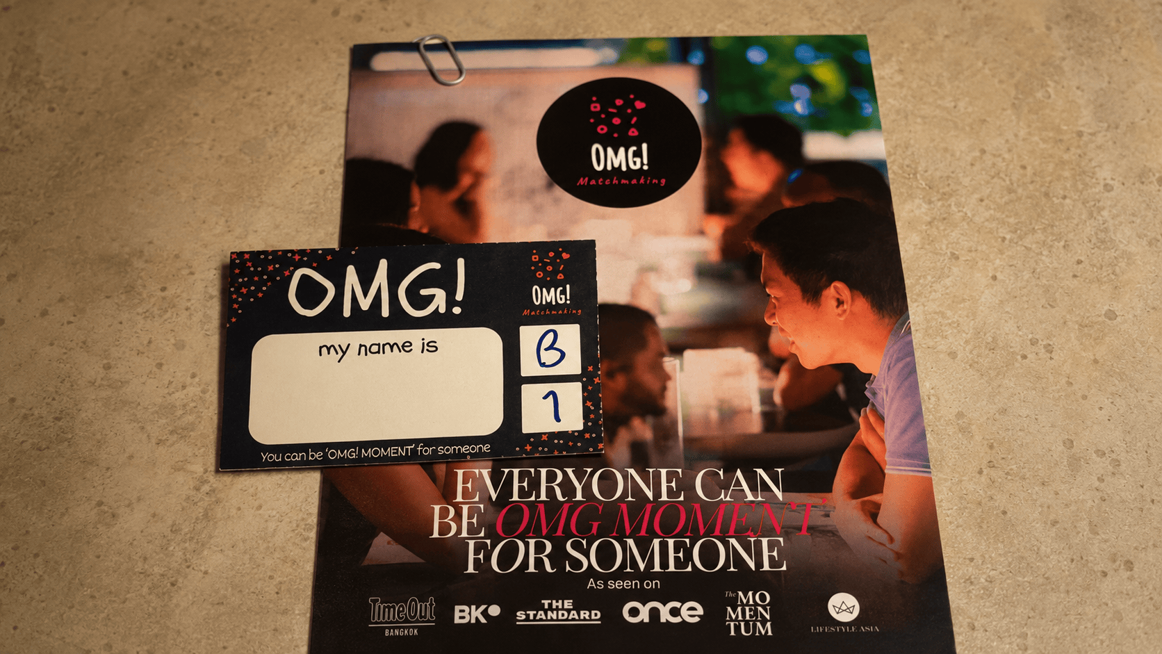 OMG Matchmaking speed dating event materials in Saigon with name tag and flyer